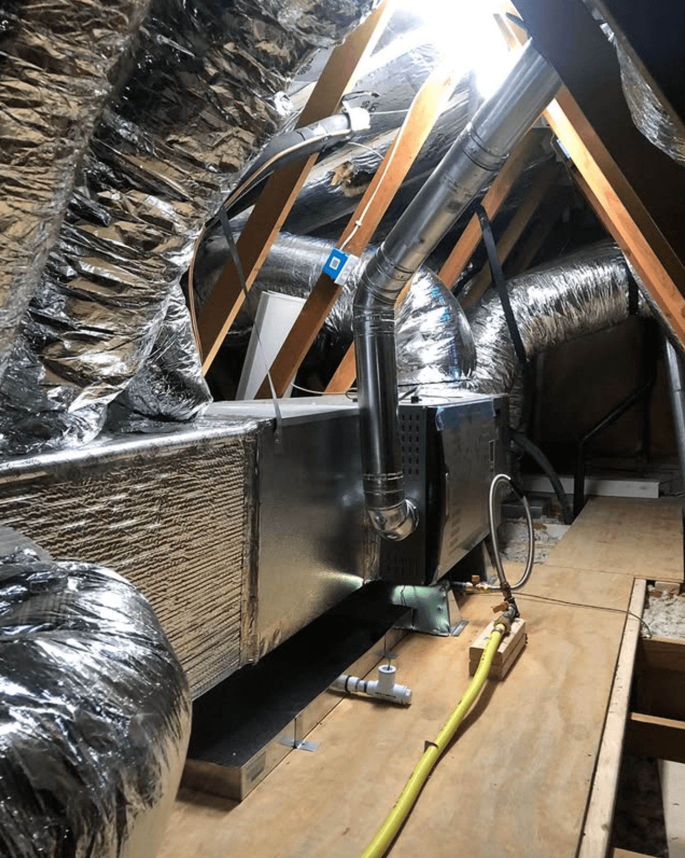 Attic ductwork and air handler installed by Comfort Kings