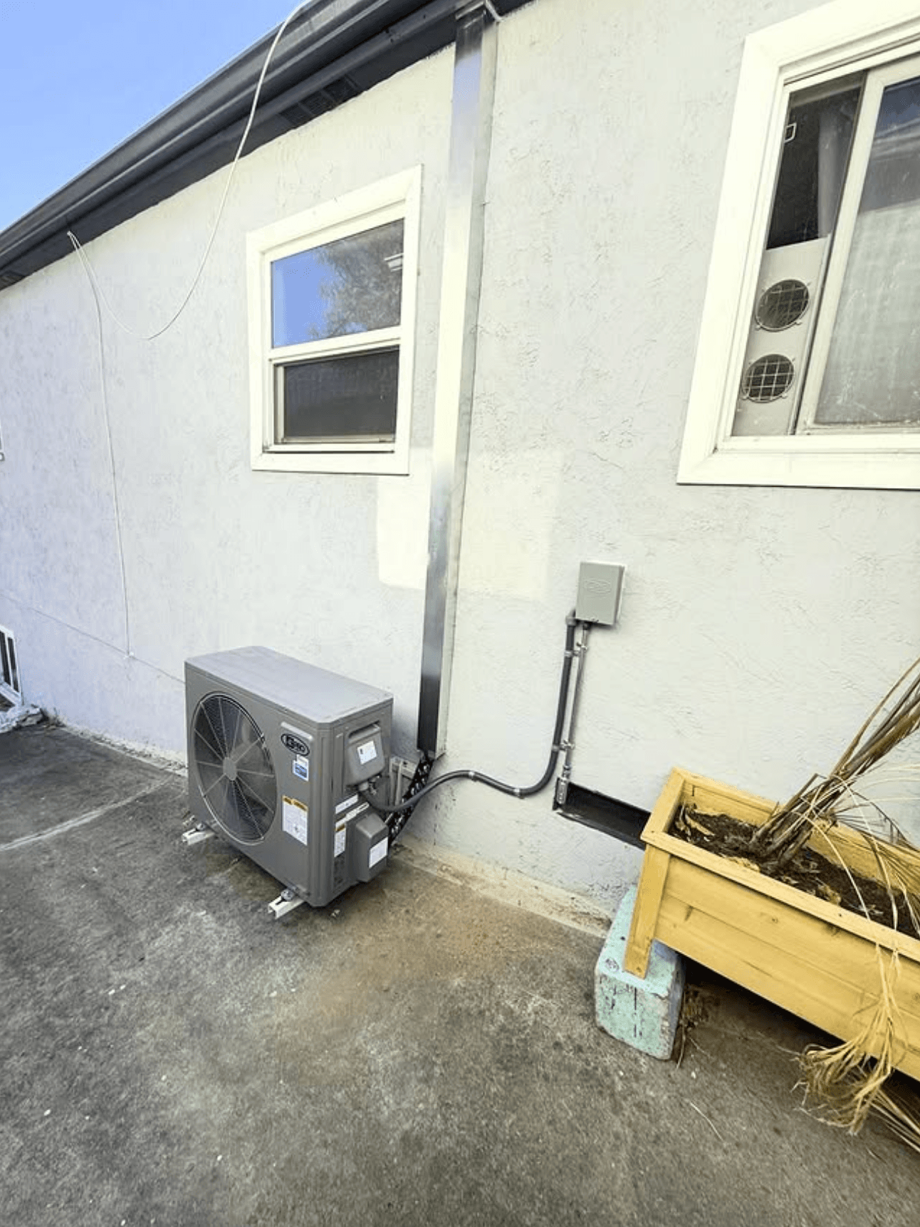 Heat pump condenser and line set installed at a San Diego County home