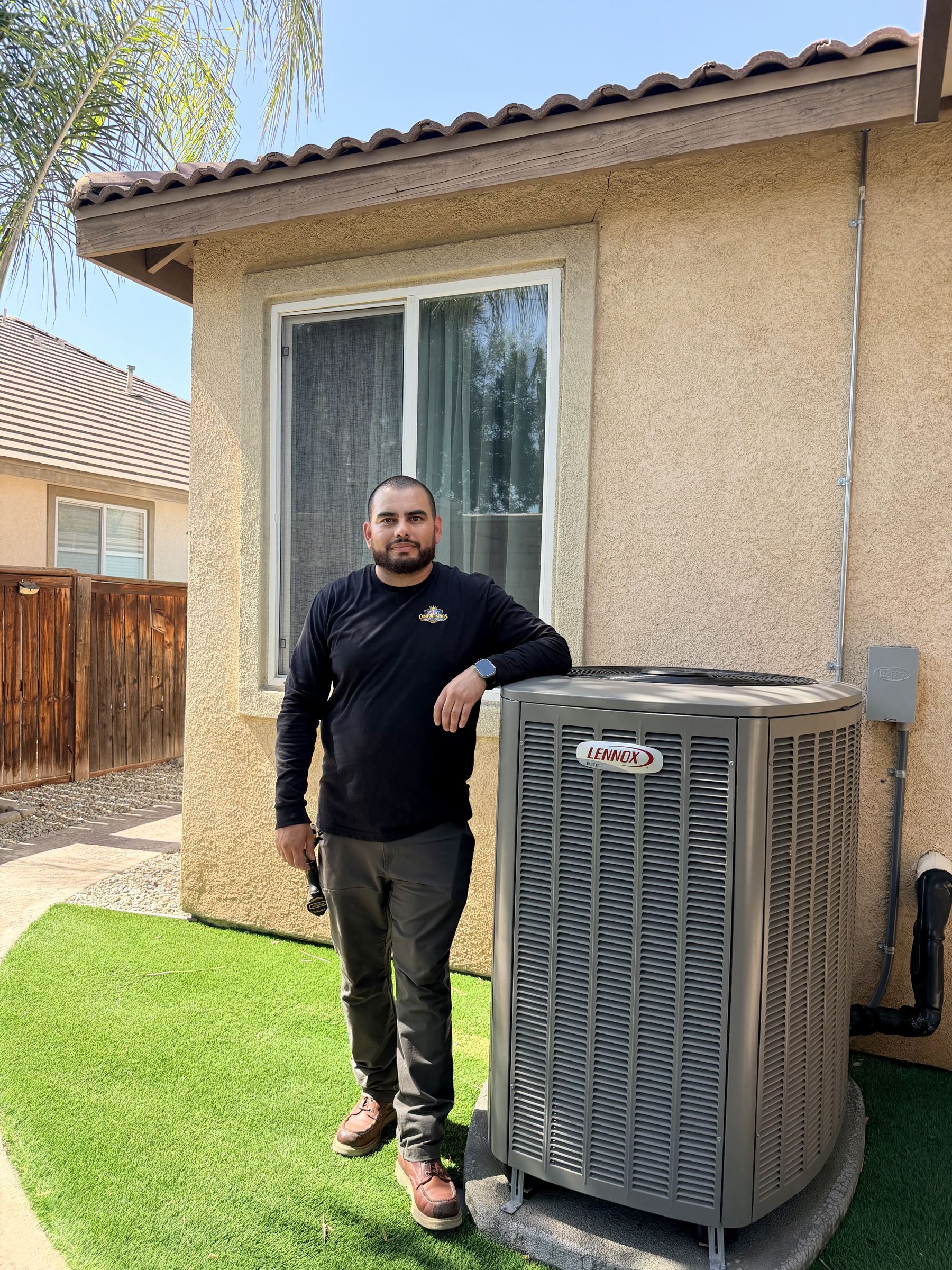 Caesar beside a condenser after a maintenance visit
