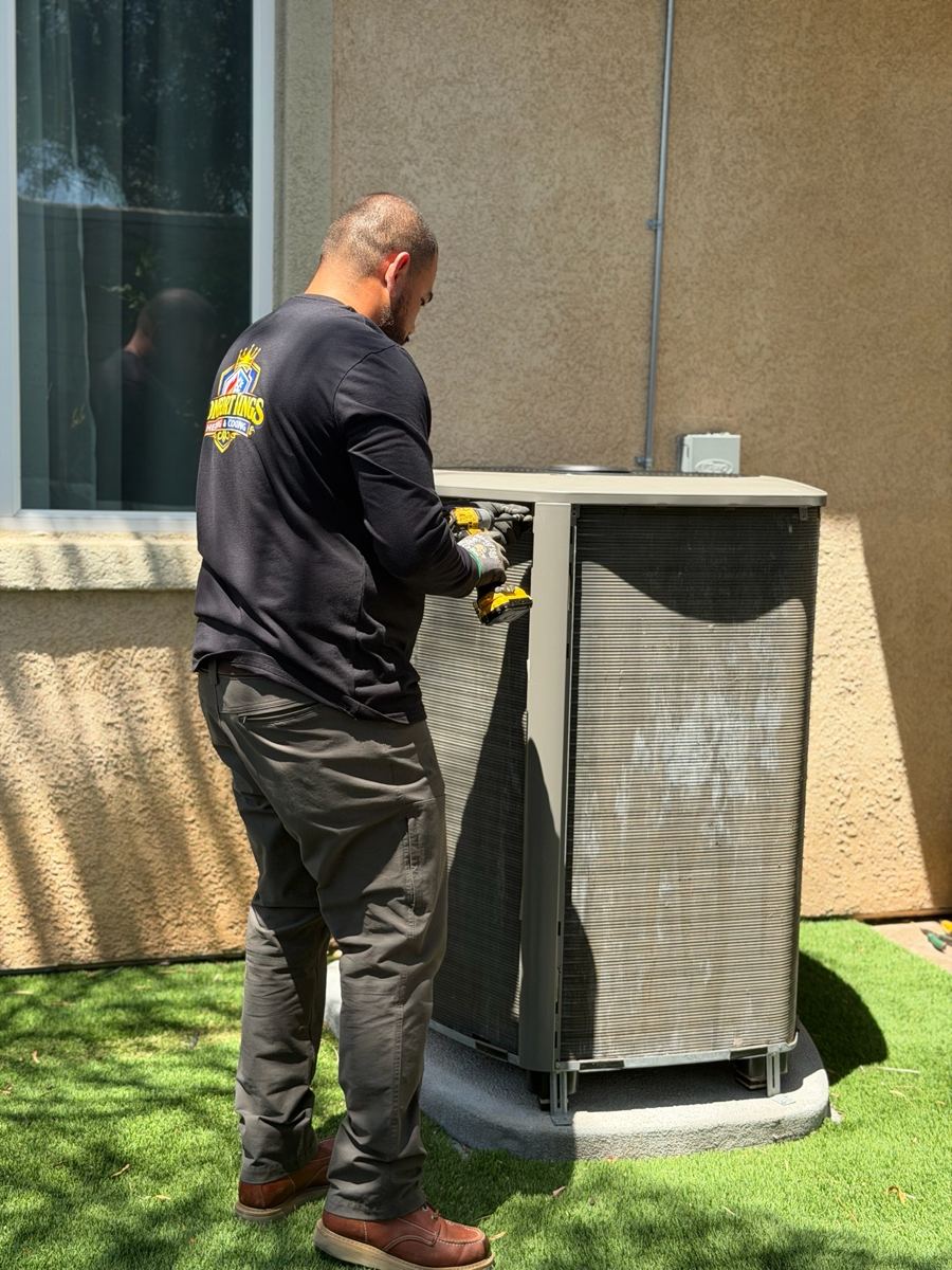 Caesar performing a tune-up on an outdoor condenser