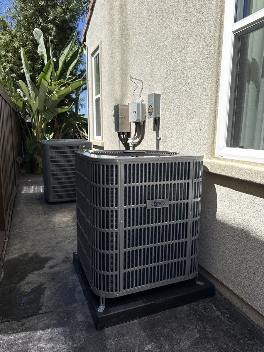 New AC condenser installed beside a Carlsbad home