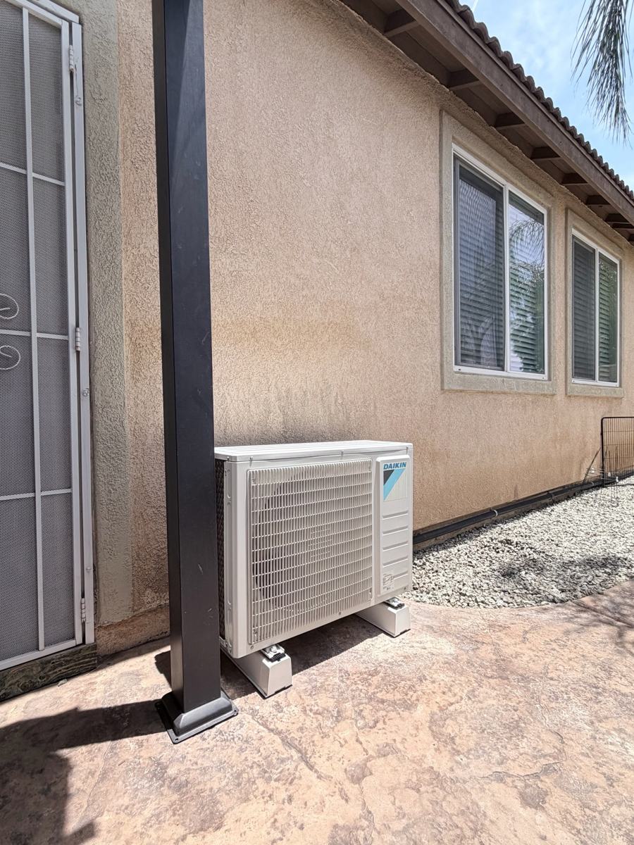 Mini-split condenser installed beside a Menifee home
