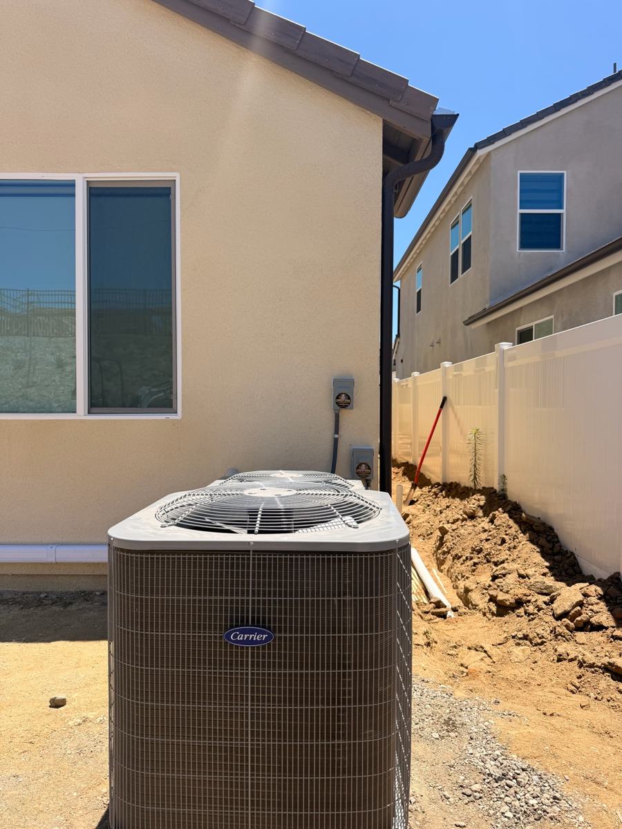Relocated AC condenser beside an Oceanside home