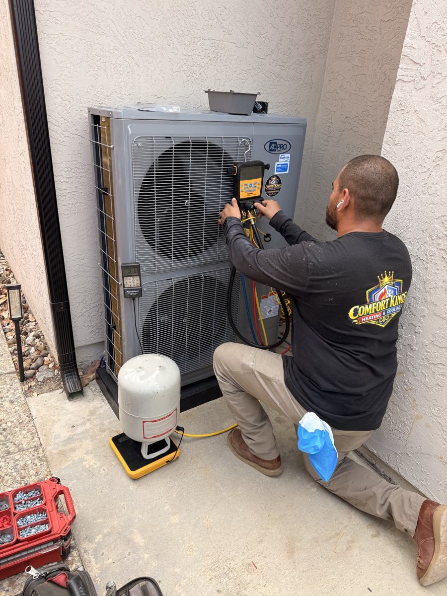 Technician charging a new heat pump in Oceanside