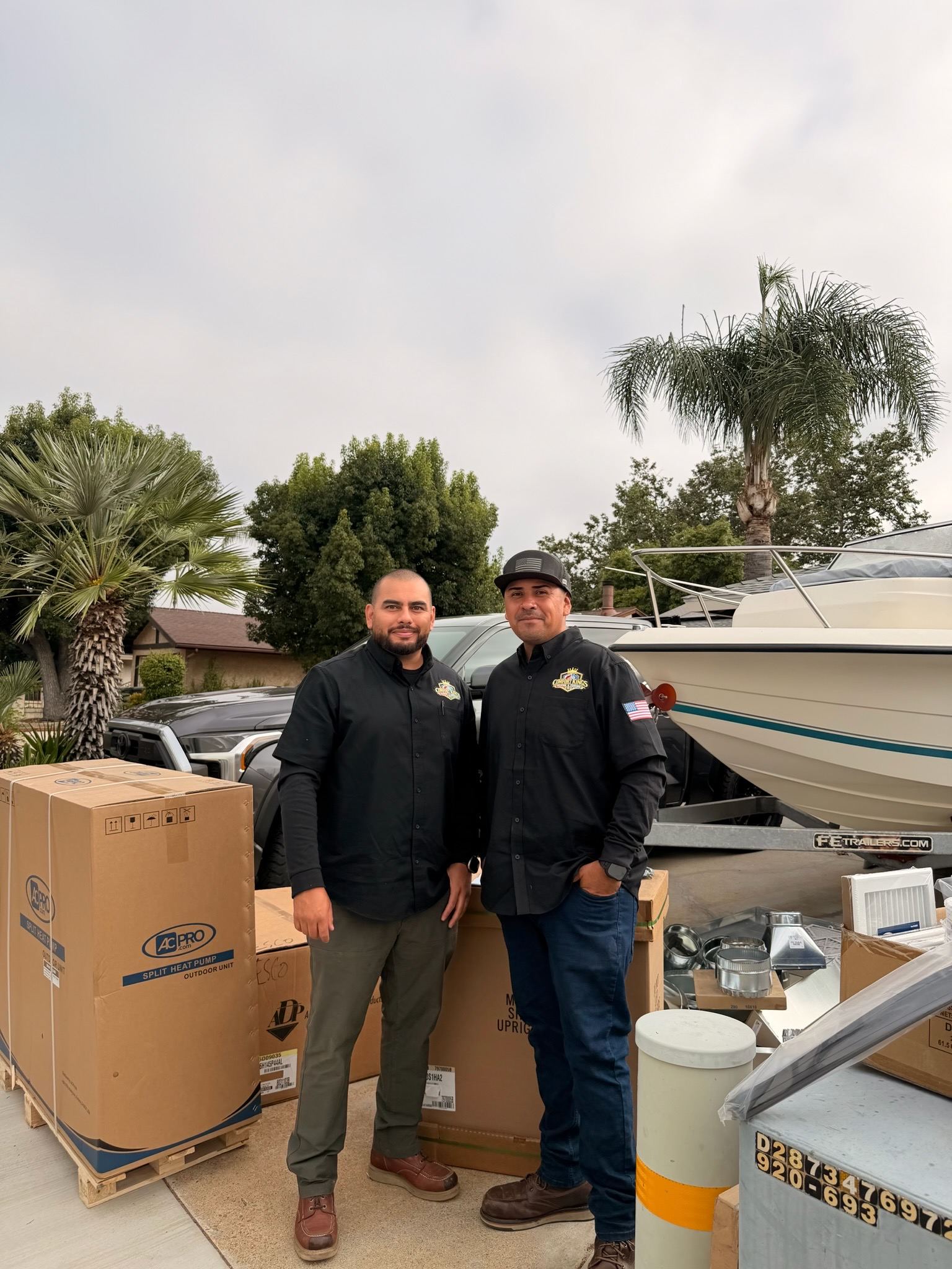 David and Caesar with new equipment before an installation