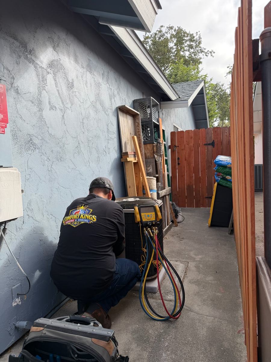 Technician working on a system replacement in Poway