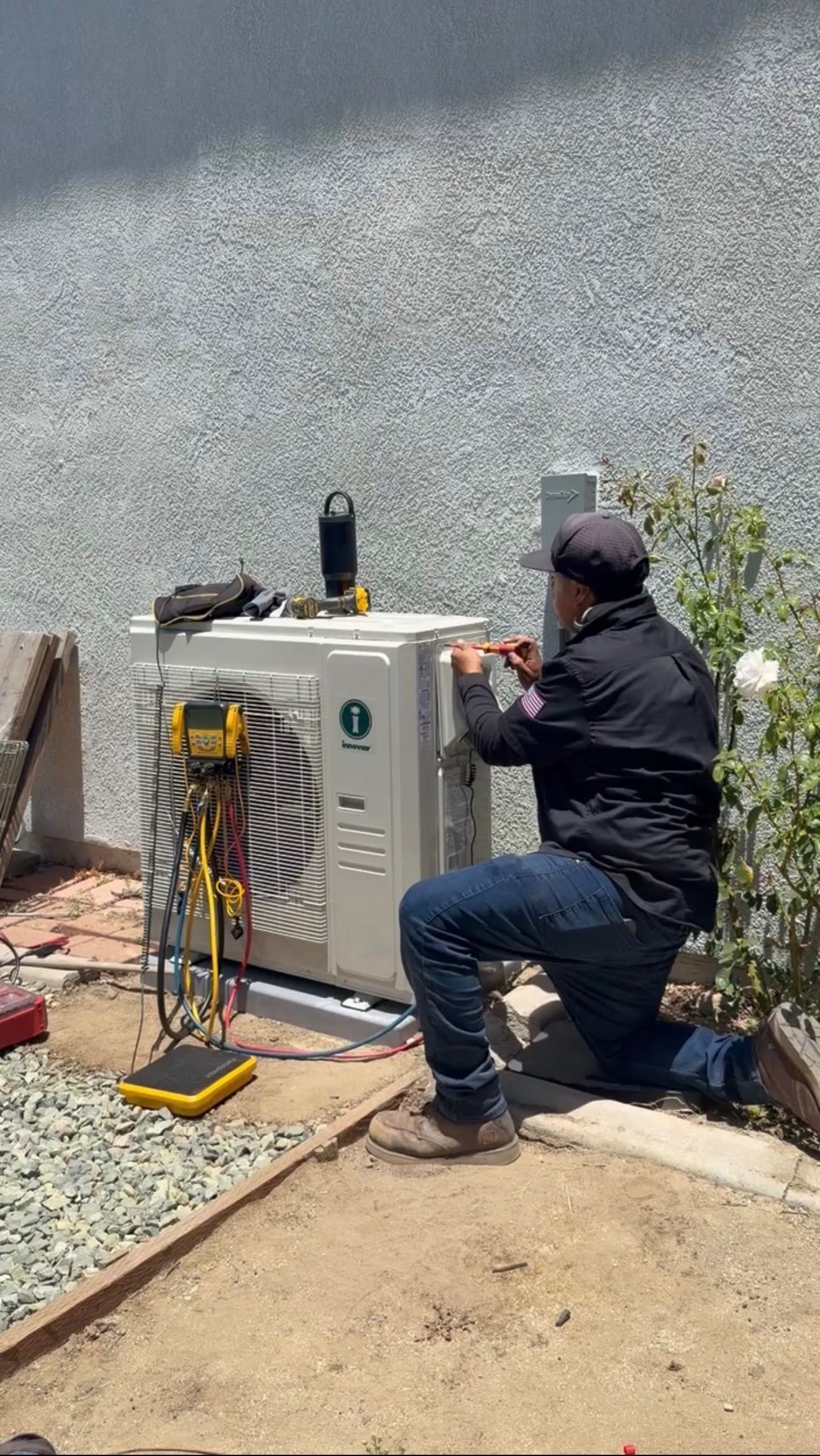 Technician completing an outdoor unit installation